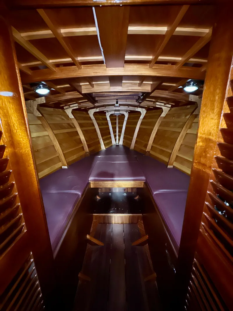 Slide: The Image of Interior of 2015 Van Dam 35 boat with wooden finish and cozy seating. - 18