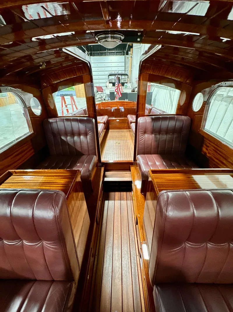 Slide: The Image of Luxurious interior of 2015 Van Dam 35 boat with polished wood and leather seating. - 19