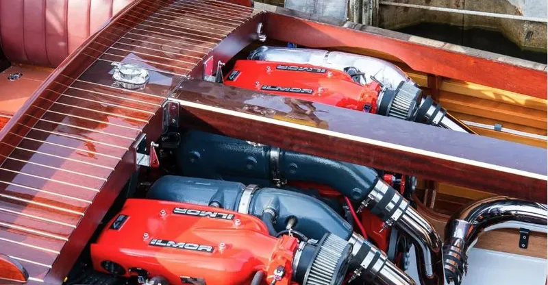 Slide: The Image of Van Dam 35 boat engine, 2015 model, featuring dual Ilmor engines with polished wood finish. - 24