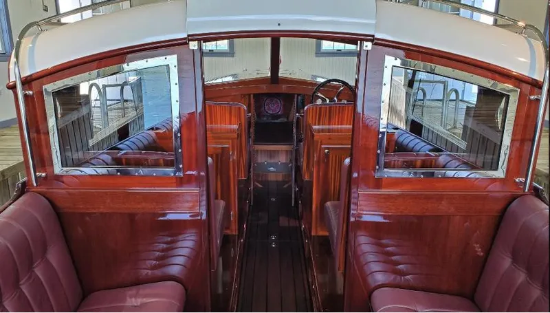 Slide: The Image of Luxurious 2015 Van Dam 35 boat interior with polished wood and plush seating. - 5