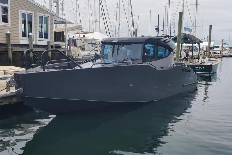 The Image of Modern 2024 G-Force 10 boat docked at a marina, showcasing sleek design and advanced features. - 0