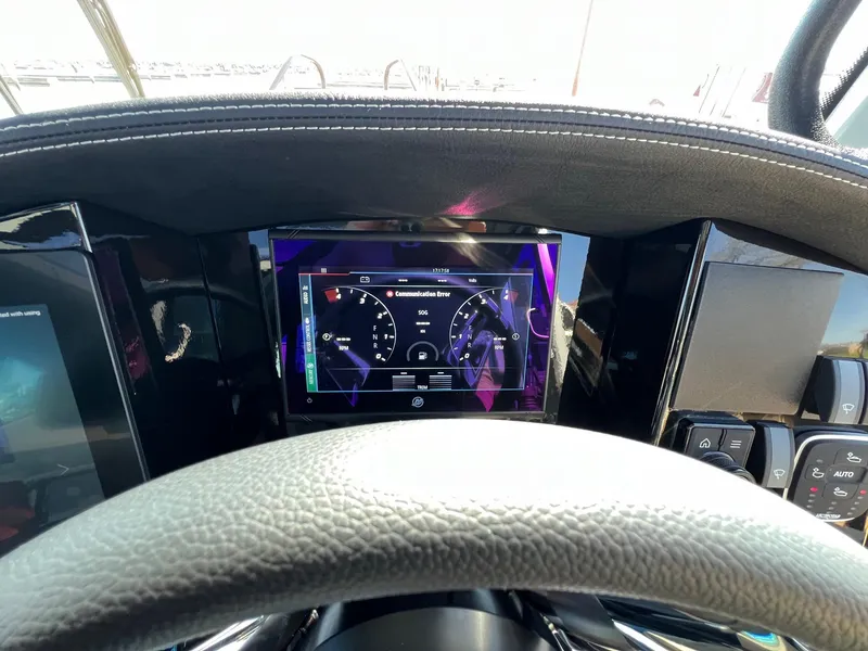 Slide: The Image of 2024 G-Force 10 dashboard with digital display and steering wheel. - 11