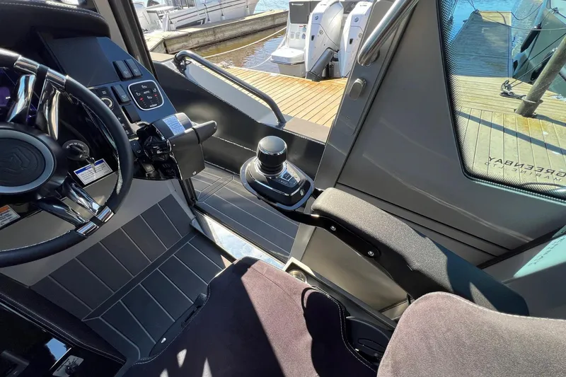 Slide: The Image of Interior of 2024 G-Force 10 boat, featuring modern controls and sleek design. - 15