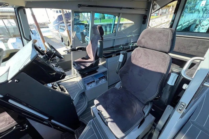 Slide: The Image of 2024 G-Force 10 boat interior with modern cockpit and comfortable seating. - 16