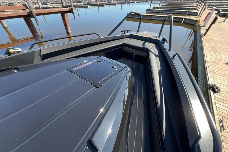 Slide: The Image of 2024 G-Force 10 boat docked, showcasing sleek design and modern features. - 18