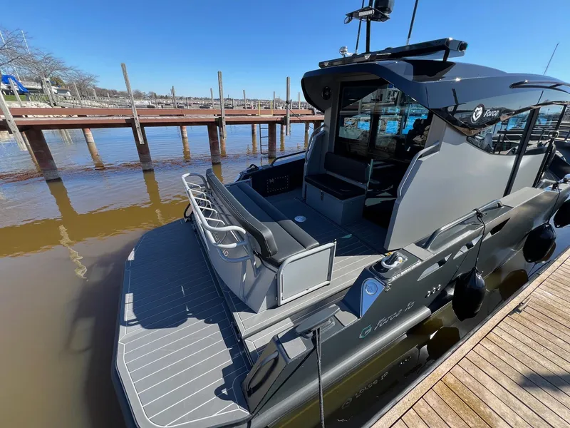 Slide: The Image of 2024 G-Force 10 boat docked, showcasing sleek design and modern features. - 2