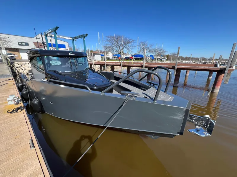 Slide: The Image of 2024 G-Force 10 boat docked at a marina under clear blue skies. - 4