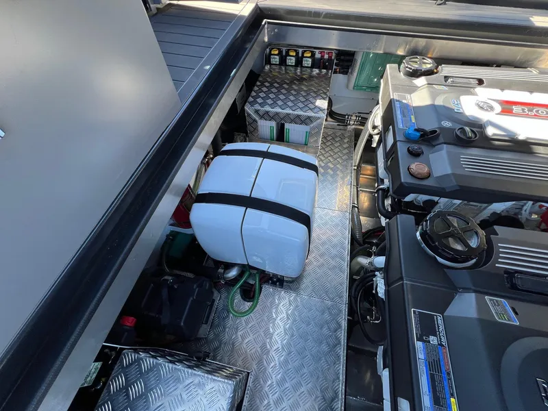 Slide: The Image of Engine compartment of 2024 G-Force 10 boat with dual engines and storage. - 5