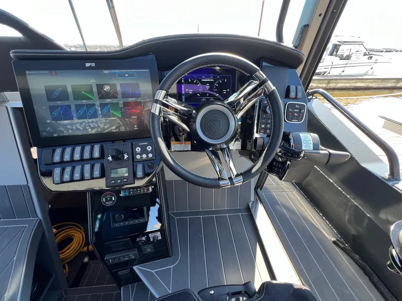 Slide: The Image of 2024 G-Force 10 boat cockpit with advanced controls and touchscreen display. - 9
