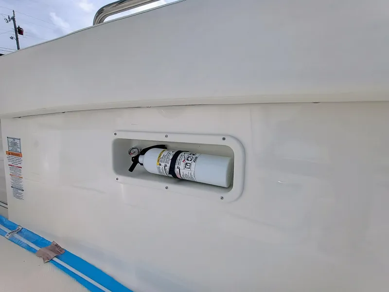 Slide: The Image of 2025 Robalo R270 Center Console boat with mounted fire extinguisher. - 33