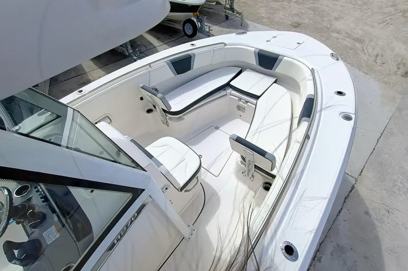Slide: The Image of 2025 Robalo R270 Center Console boat interior with white seating and modern design. - 41