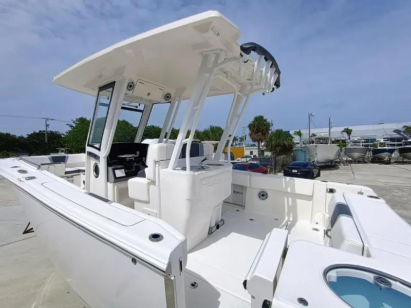 Slide: The Image of 2025 Robalo R270 Center Console boat with sleek design, spacious deck, and modern features. - 7