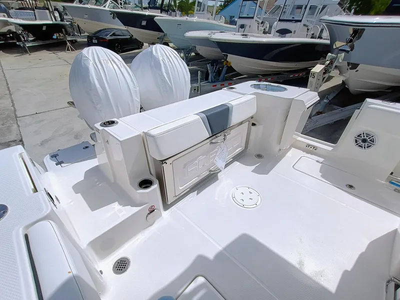 Slide: The Image of 2025 Robalo R270 Center Console boat with dual engines, spacious deck, and modern design. - 8
