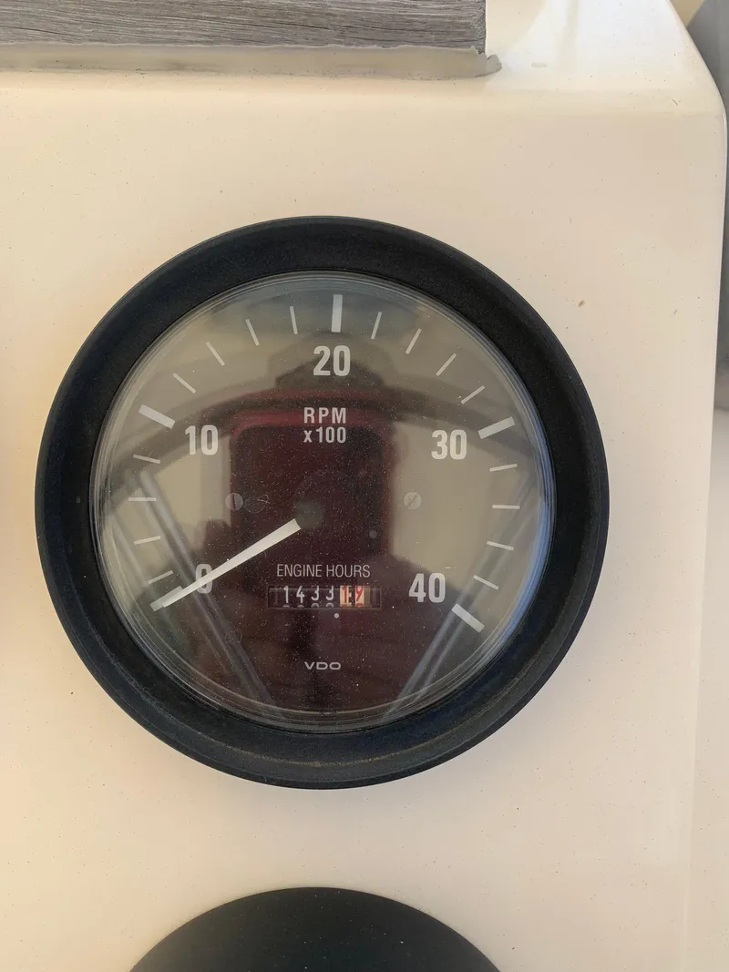 Slide: The Image of RPM gauge on 2004 Mainship Pilot 30-II Sedan boat dashboard. - 21