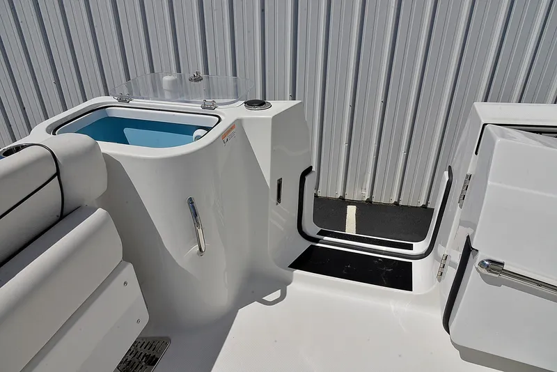 Slide: The Image of 2021 Wellcraft 262 Fisherman boat interior with seating and storage compartments. - 13