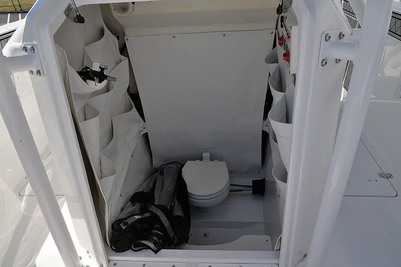 Slide: The Image of Interior of 2021 Wellcraft 262 Fisherman boat with storage and toilet. - 17