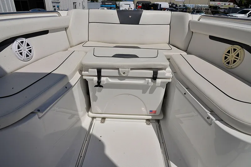 Slide: The Image of 2021 Wellcraft 262 Fisherman boat interior with seating and cooler. - 18