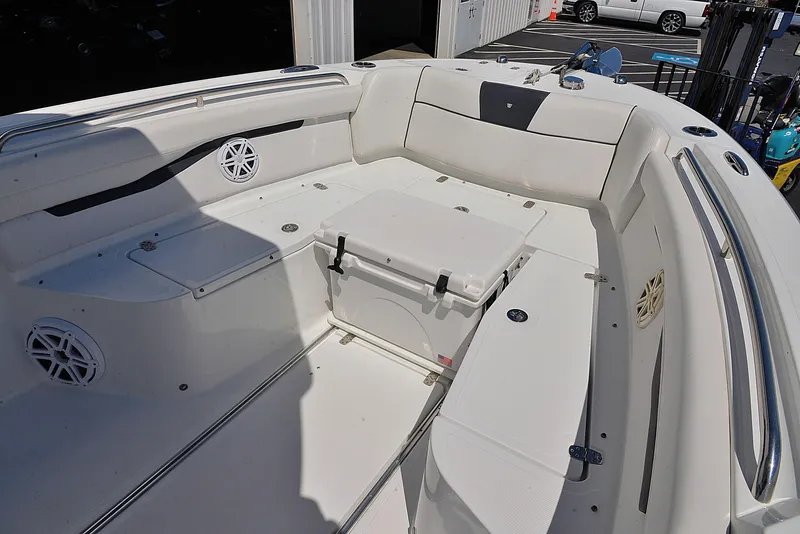 Slide: The Image of 2021 Wellcraft 262 Fisherman boat interior with seating and storage compartments. - 19