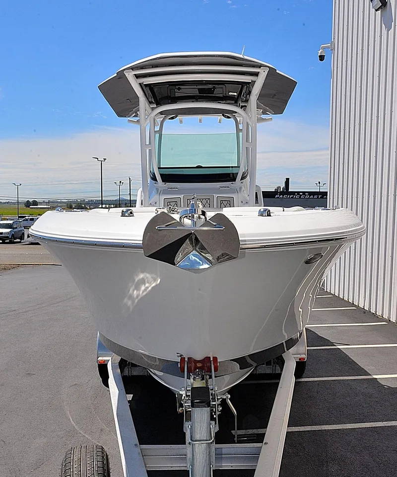 Slide: The Image of 2021 Wellcraft 262 Fisherman boat on trailer, front view, outdoors. - 4