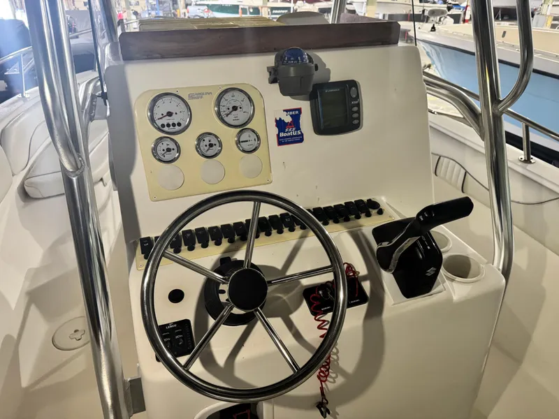 Slide: The Image of Control panel of a 2012 Carolina Skiff Sea Chaser 2400 Offshore boat. - 10