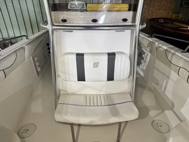 Slide: The Image of 2012 Carolina Skiff Sea Chaser 2400 Offshore boat interior with seating and console. - 12