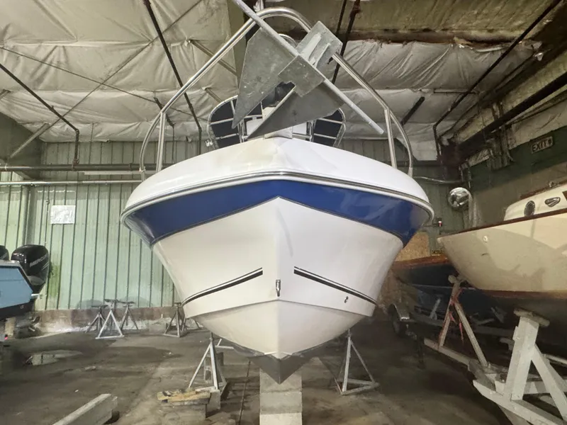 Slide: The Image of 2012 Carolina Skiff Sea Chaser 2400 Offshore boat in storage, front view. - 2