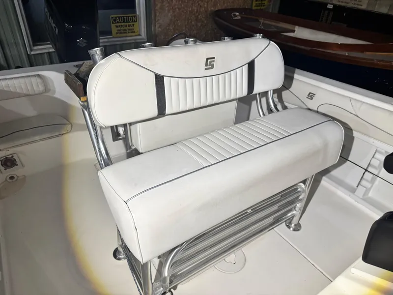Slide: The Image of 2012 Carolina Skiff Sea Chaser 2400 Offshore boat seat, white upholstery, chrome frame. - 20