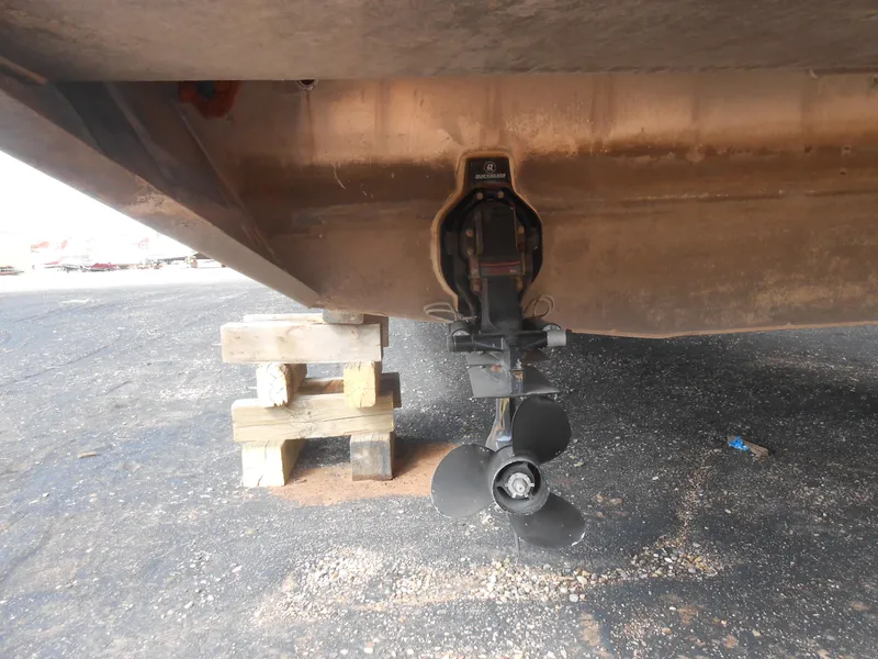 Slide: The Image of 1994 Stardust Cruisers houseboat propeller and hull on dry dock support. - 24