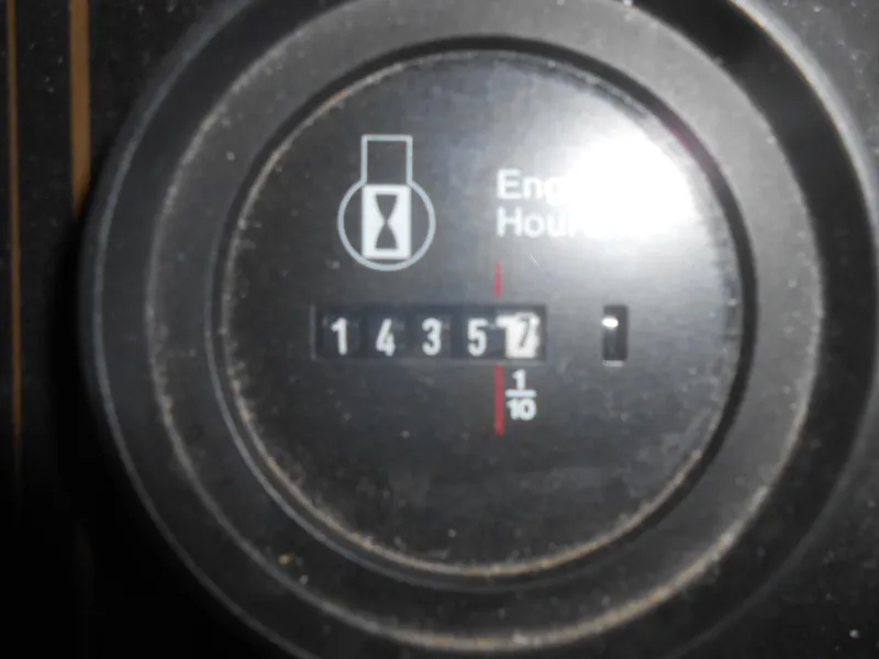 Slide: The Image of Engine hour meter showing 1,435.7 hours on 1994 Stardust Cruisers houseboat. - 4