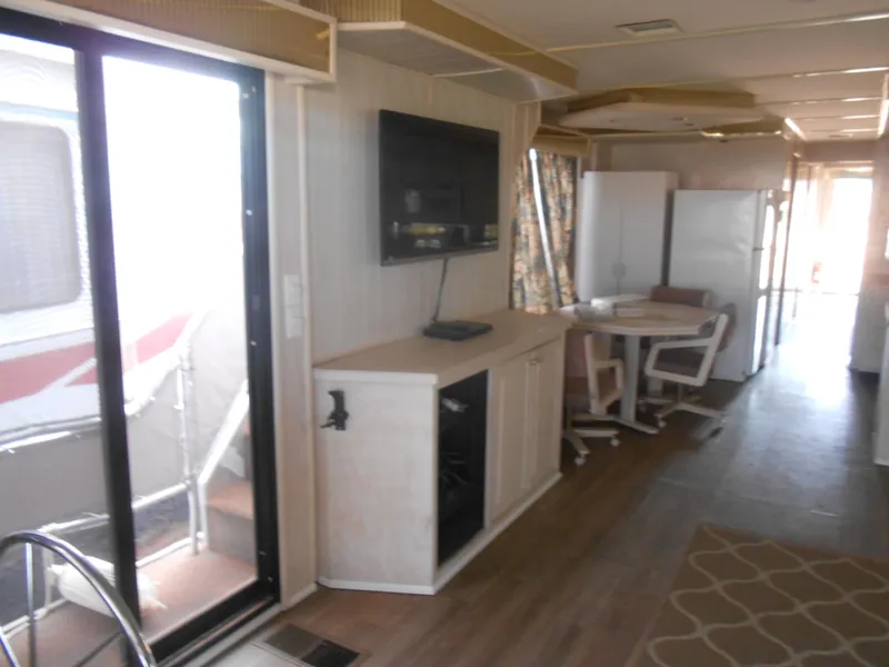 Slide: The Image of Interior of a 1994 Stardust Cruisers houseboat with modern amenities and cozy furnishings. - 8