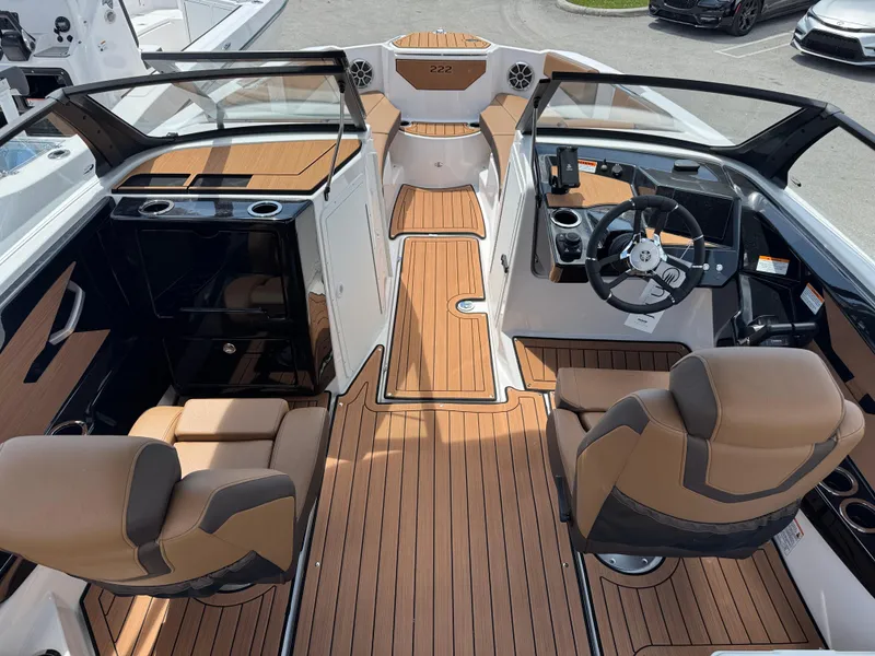 Slide: The Image of 2025 Yamaha Boats 222S interior with sleek design, dual seating, and modern dashboard. - 4