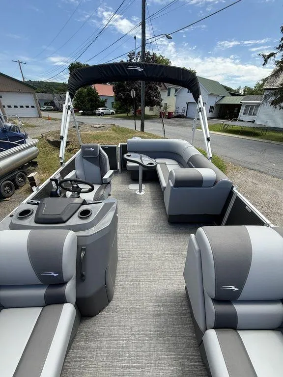 Slide: The Image of 2025 Bennington S L-Bench 18SVL pontoon boat with spacious seating and modern design. - 4