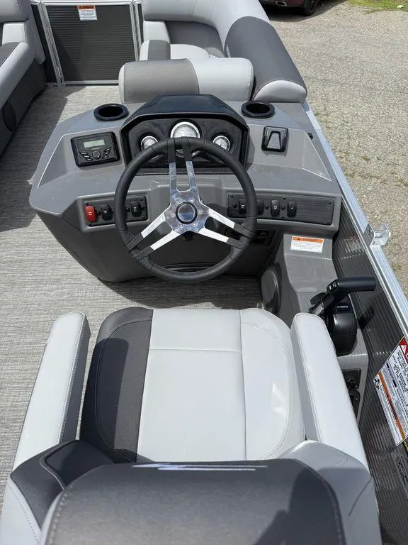 Slide: The Image of 2025 Bennington S L-Bench 18SVL boat cockpit with steering wheel and control panel. - 8