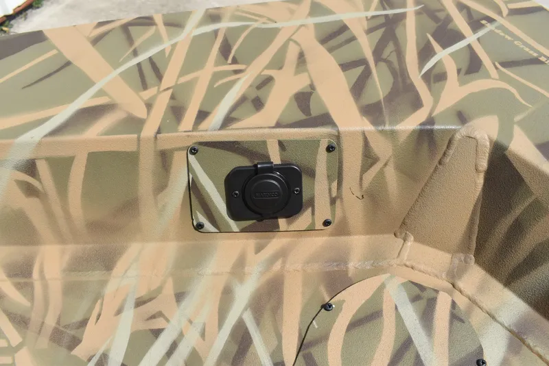 Slide: The Image of Camouflage pattern on 2025 Lowe RX1860 Tunnel Jet boat with a mounted accessory. - 12