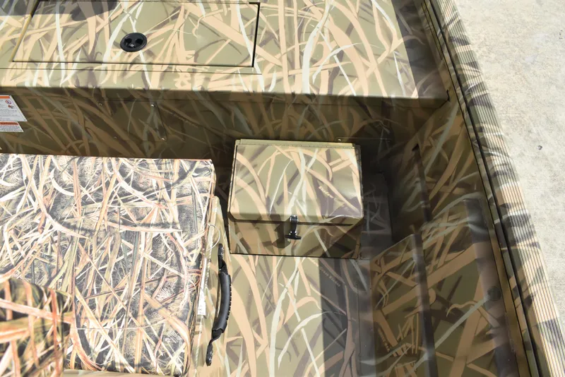 Slide: The Image of Camouflage interior of 2025 Lowe RX1860 Tunnel Jet boat with storage compartments. - 17