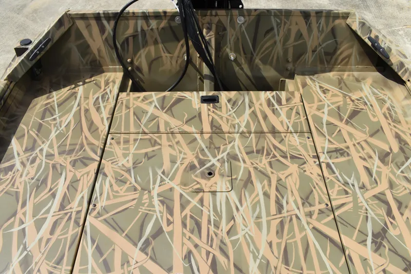 Slide: The Image of 2025 Lowe RX1860 Tunnel Jet boat with camouflage pattern interior. - 24