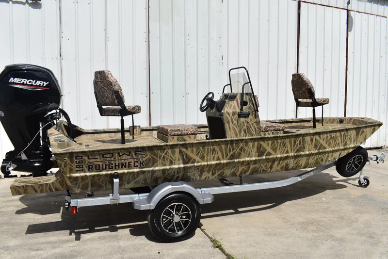 Slide: The Image of 2025 Lowe RX1860 Tunnel Jet boat with camouflage design on a trailer. - 3