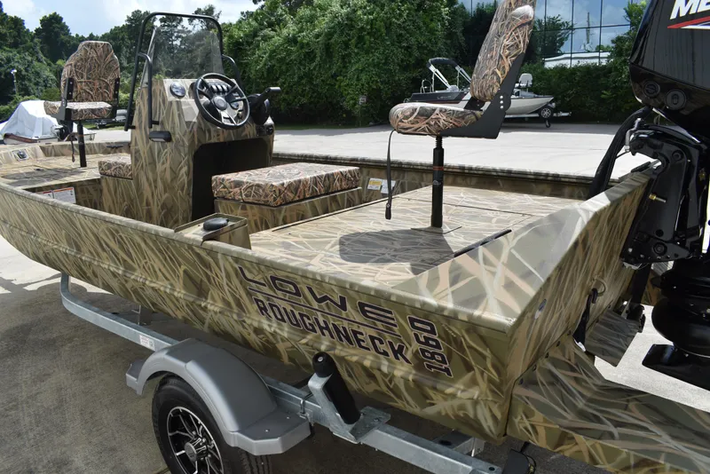 Slide: The Image of 2025 Lowe RX1860 Tunnel Jet boat with camouflage design on a trailer. - 5