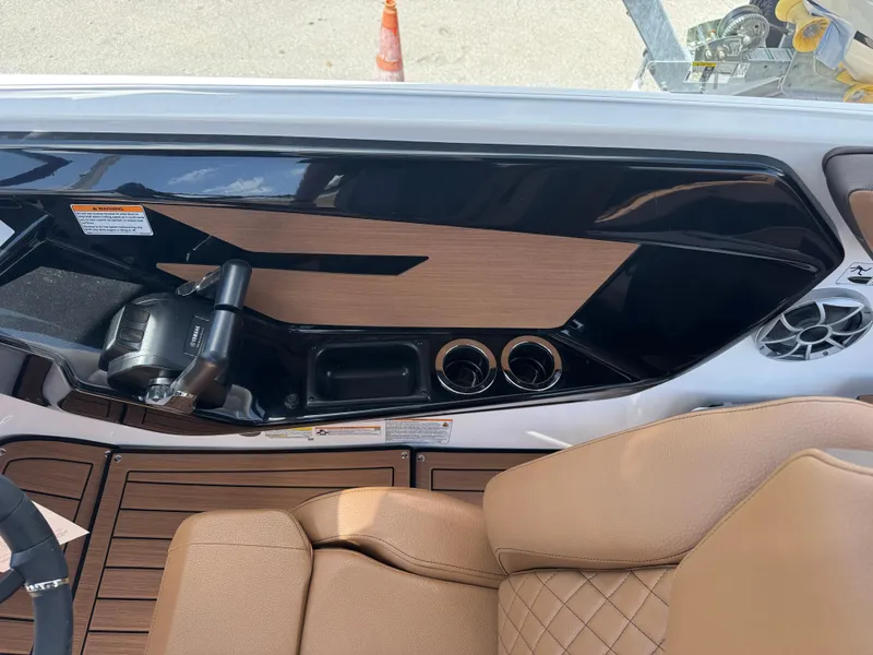 Slide: The Image of Interior of 2025 Yamaha Boats 222S, featuring sleek controls and luxurious seating. - 17
