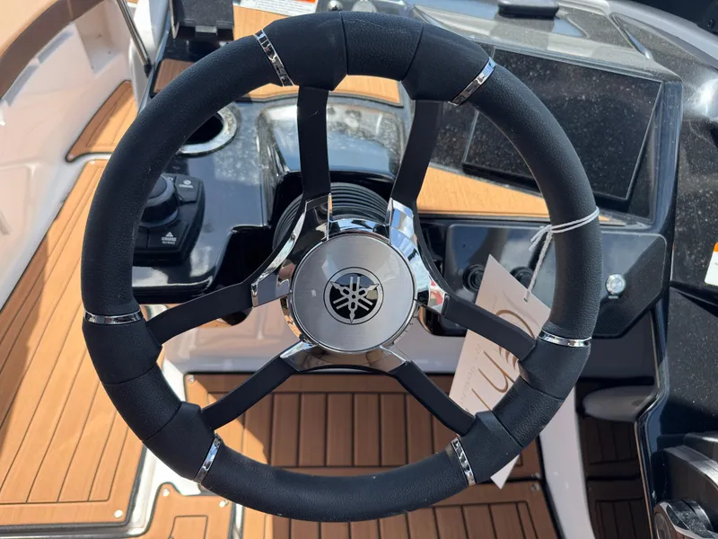 Slide: The Image of Steering wheel of 2025 Yamaha Boats 222S, featuring sleek design and modern controls. - 21