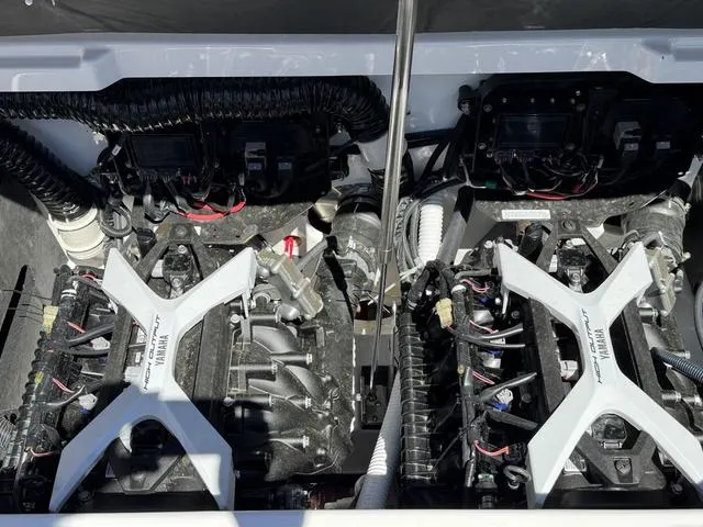 Slide: The Image of 2025 Yamaha Boats 222SD engine compartment showcasing dual engines and intricate wiring. - 32