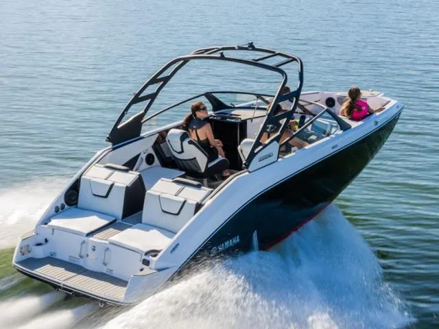 Slide: The Image of 2025 Yamaha Boats 222SD cruising on water with passengers enjoying the ride. - 35