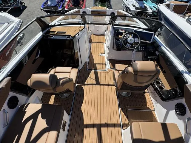Slide: The Image of 2025 Yamaha Boats 222SD interior with luxurious seating and modern dashboard design. - 7