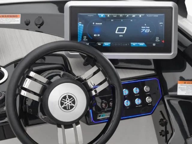 Slide: The Image of Steering wheel and digital dashboard of 2025 Yamaha Boats 222SD, showcasing modern controls. - 10