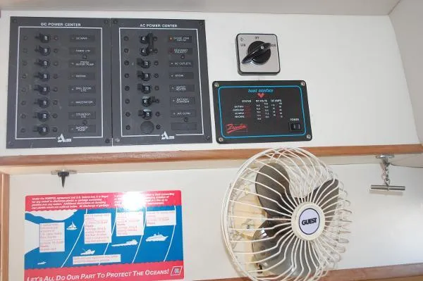 Slide: The Image of Electrical panel and fan inside a 1997 Albin 28 Tournament boat cabin. - 10