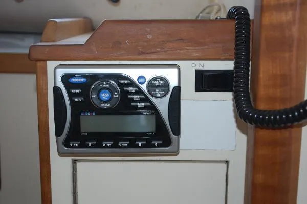 Slide: The Image of 1997 Albin 28 Tournament boat interior with a marine radio system. - 11
