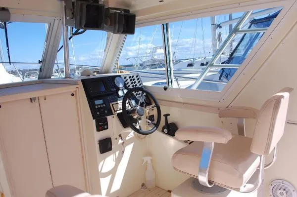 Slide: The Image of Interior of 1997 Albin 28 Tournament boat with steering wheel and control panel. - 12