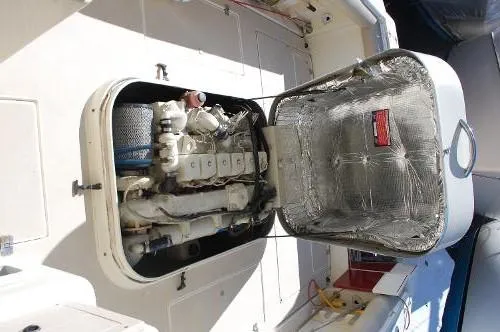 Slide: The Image of Engine compartment of a 1997 Albin 28 Tournament boat, showcasing detailed mechanical components. - 17