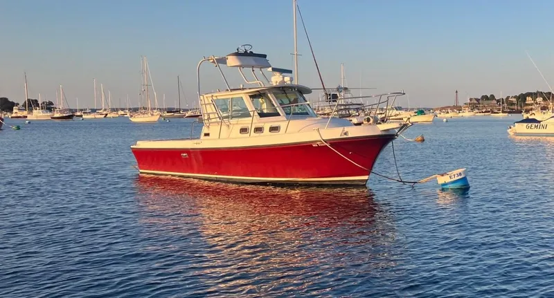 Slide: The Image of Red 1997 Albin 28 Tournament boat anchored in a calm harbor. - 21