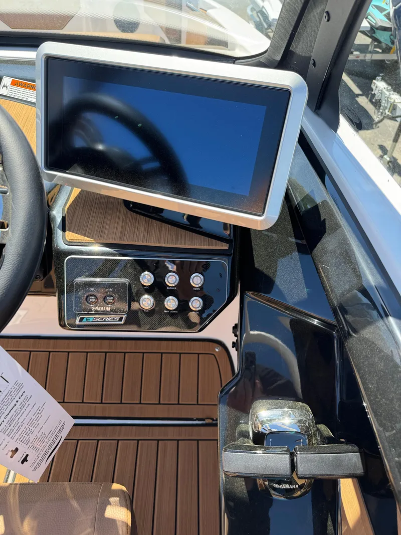 Slide: The Image of 2025 Yamaha Boats 222SD dashboard with touchscreen display and control panel. - 11